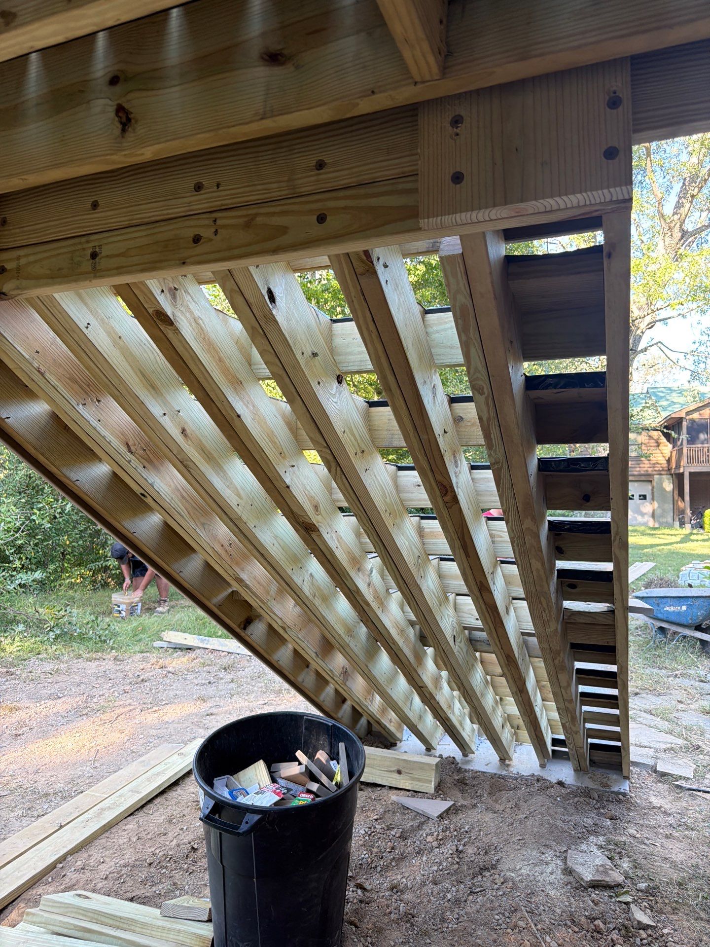 Log Cabin Wrap-Around Deck and External Staircase Installation in Caldwell by Walnut Hollow Decks & Outdoor Living