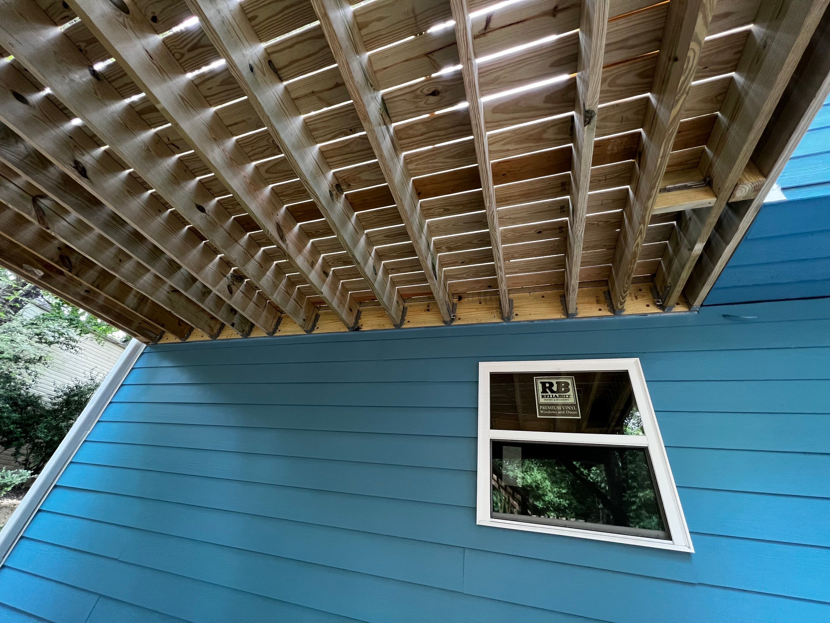 Elevated Wood Deck and Blue Lap Siding Installation in Kennesaw by Swift Home Renovations