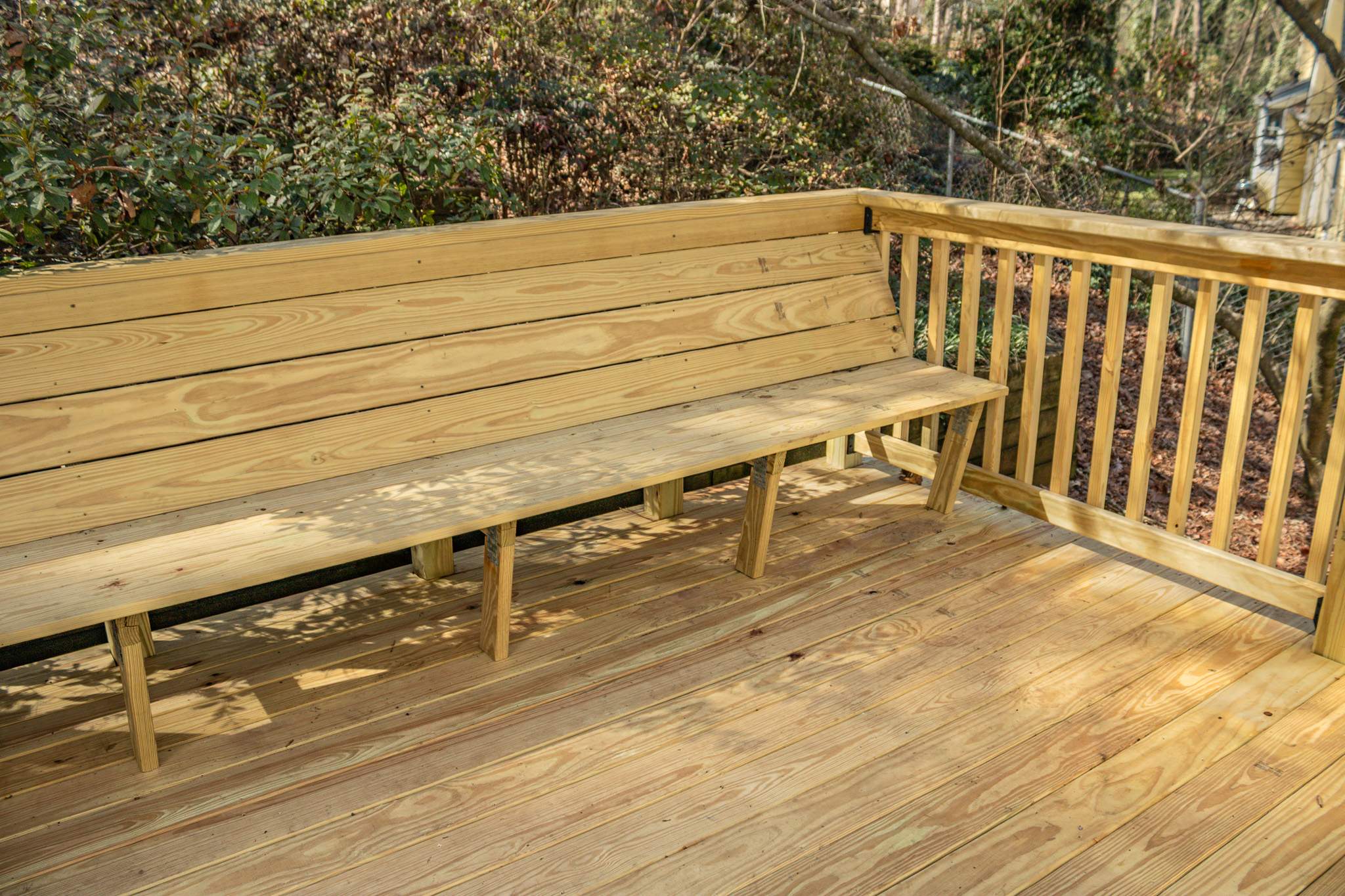 Deck Resurface with Wood Bench Install Using Pressure Treated Pine by Nelson Exteriors