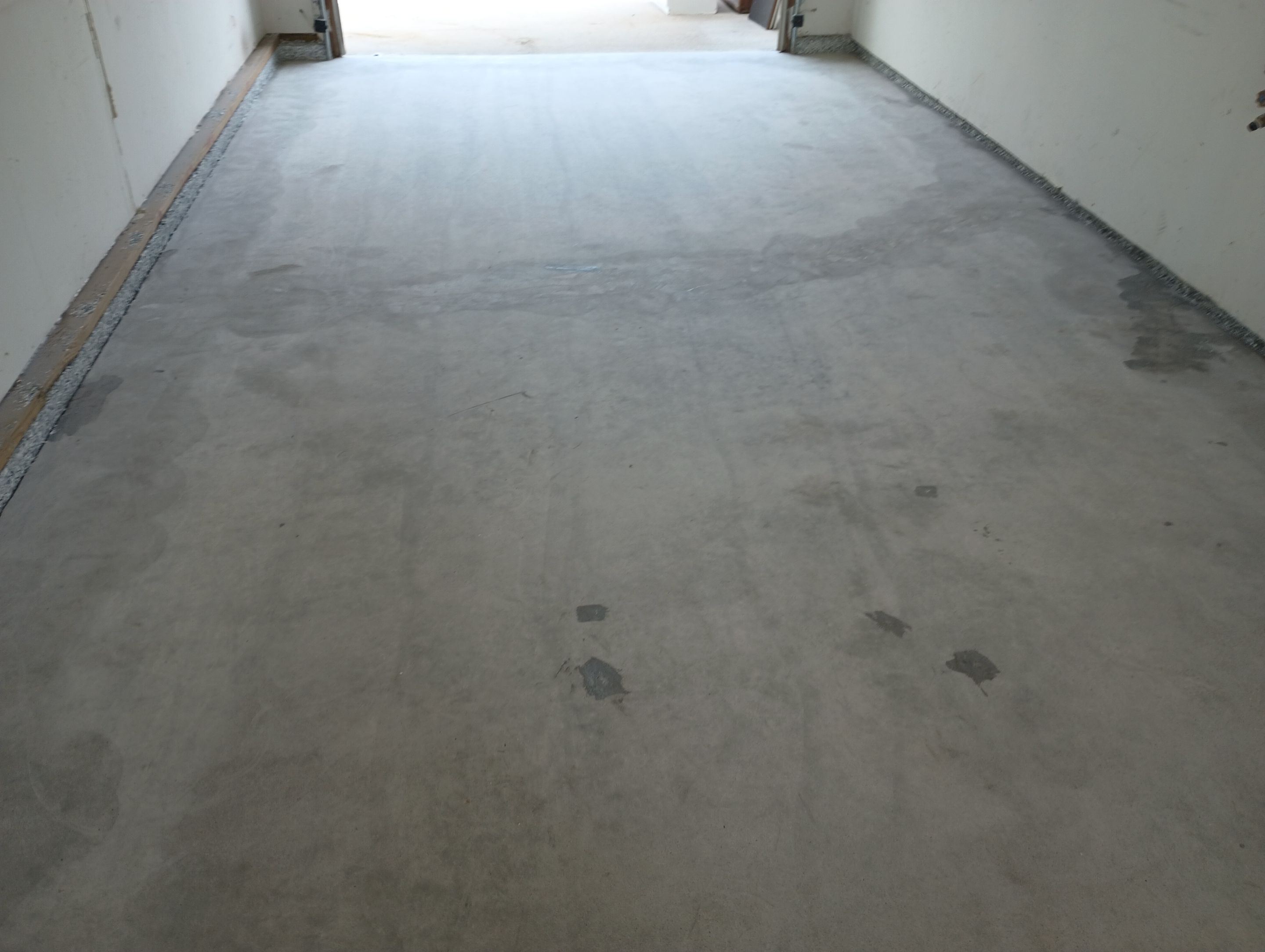 Garage Concrete Coating Installation in Sioux Falls Using Tidal Wave Finish by Select Painting, Coatings & Garage Cabinets