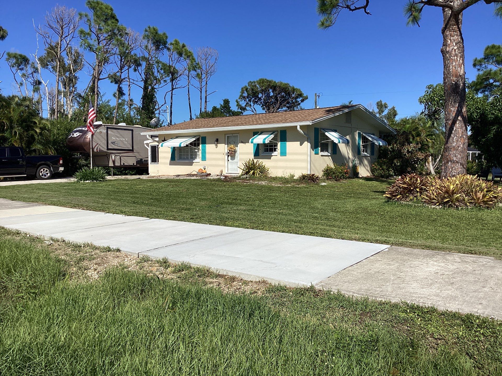 3x4 Downspouts and Seamless Gutters for Coastal Homes in St James City FL by Gutter Professors