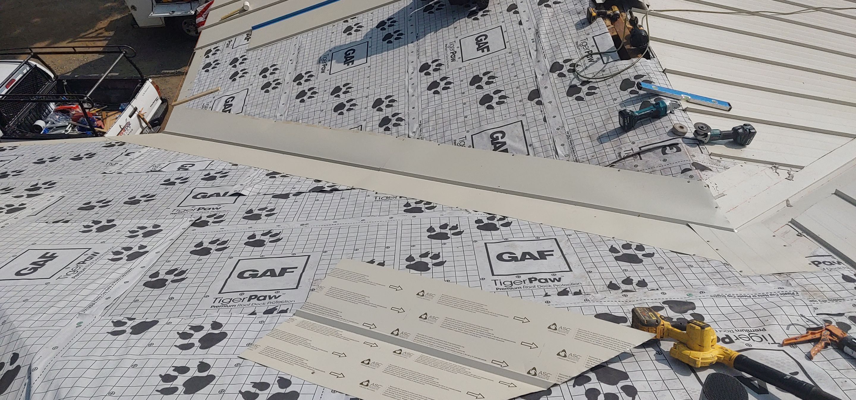 Residential Roofing Installation using Standing seam metal roofing system by Straight Edge Roofing Inc