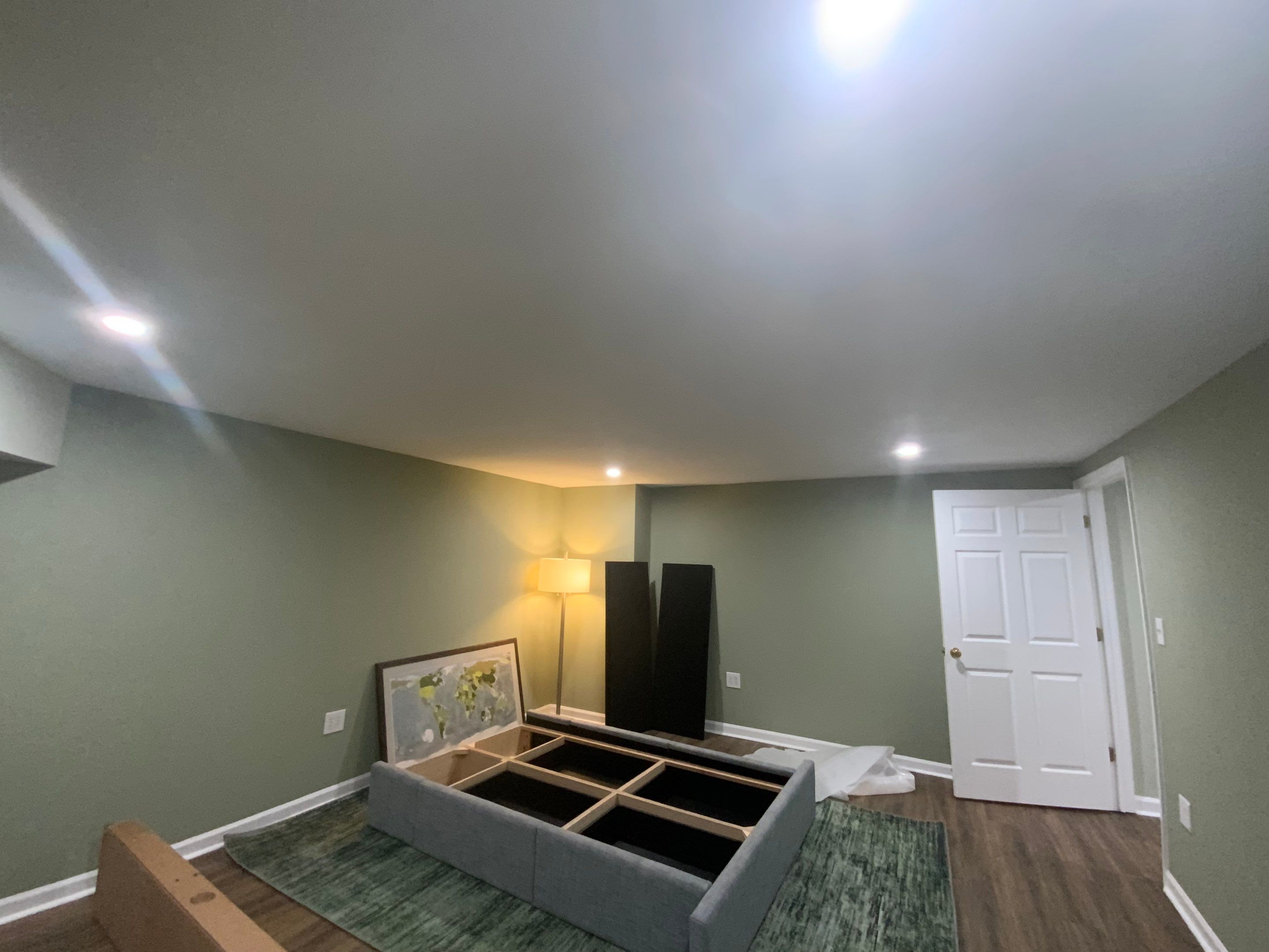 Finished Basement Room Transformation with Wood-Look Flooring in Roswell by Swift Home Renovations