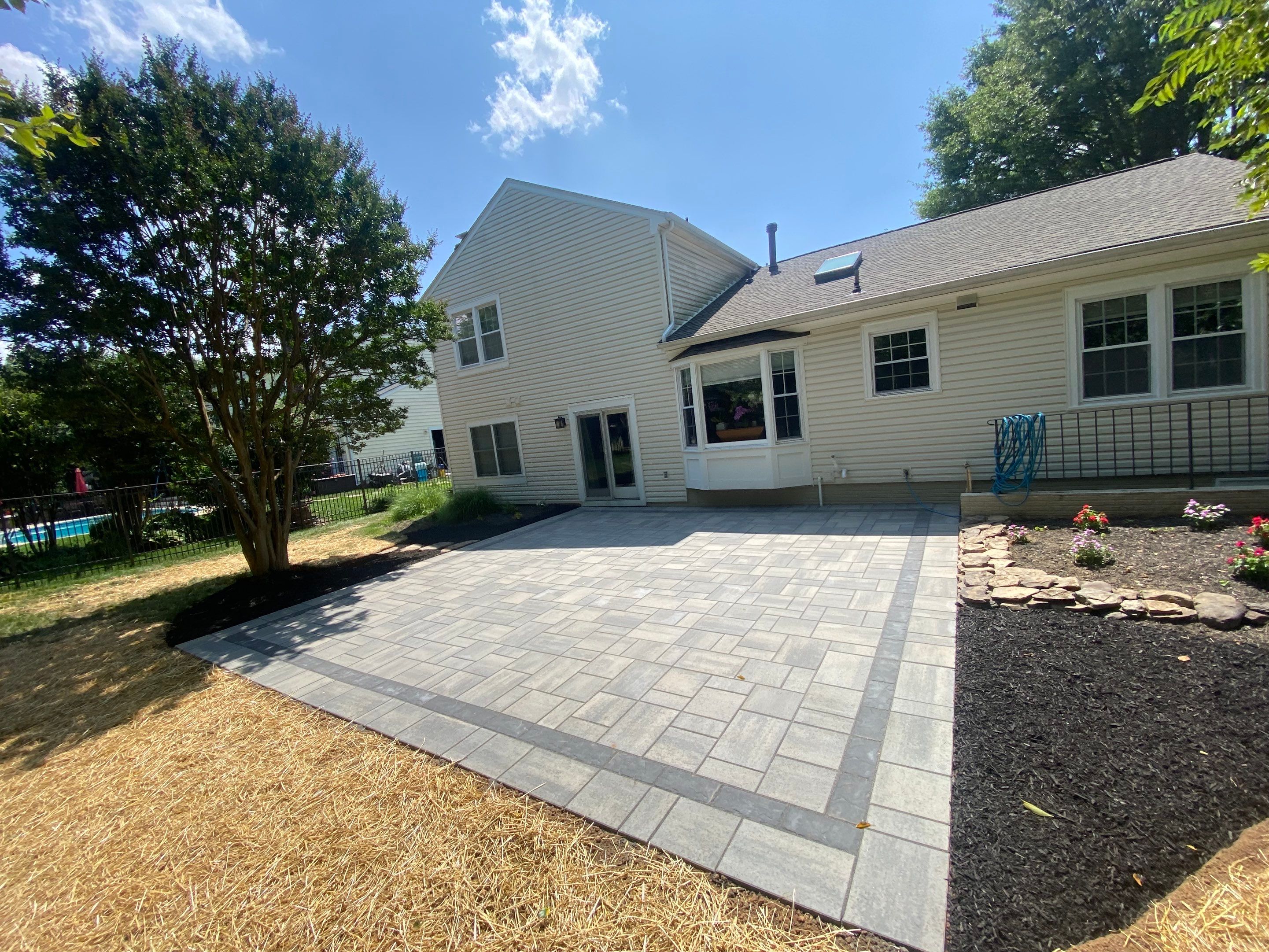 Backyard Transformation using Techo-Bloc Pavers by The Smet Companies, LLC