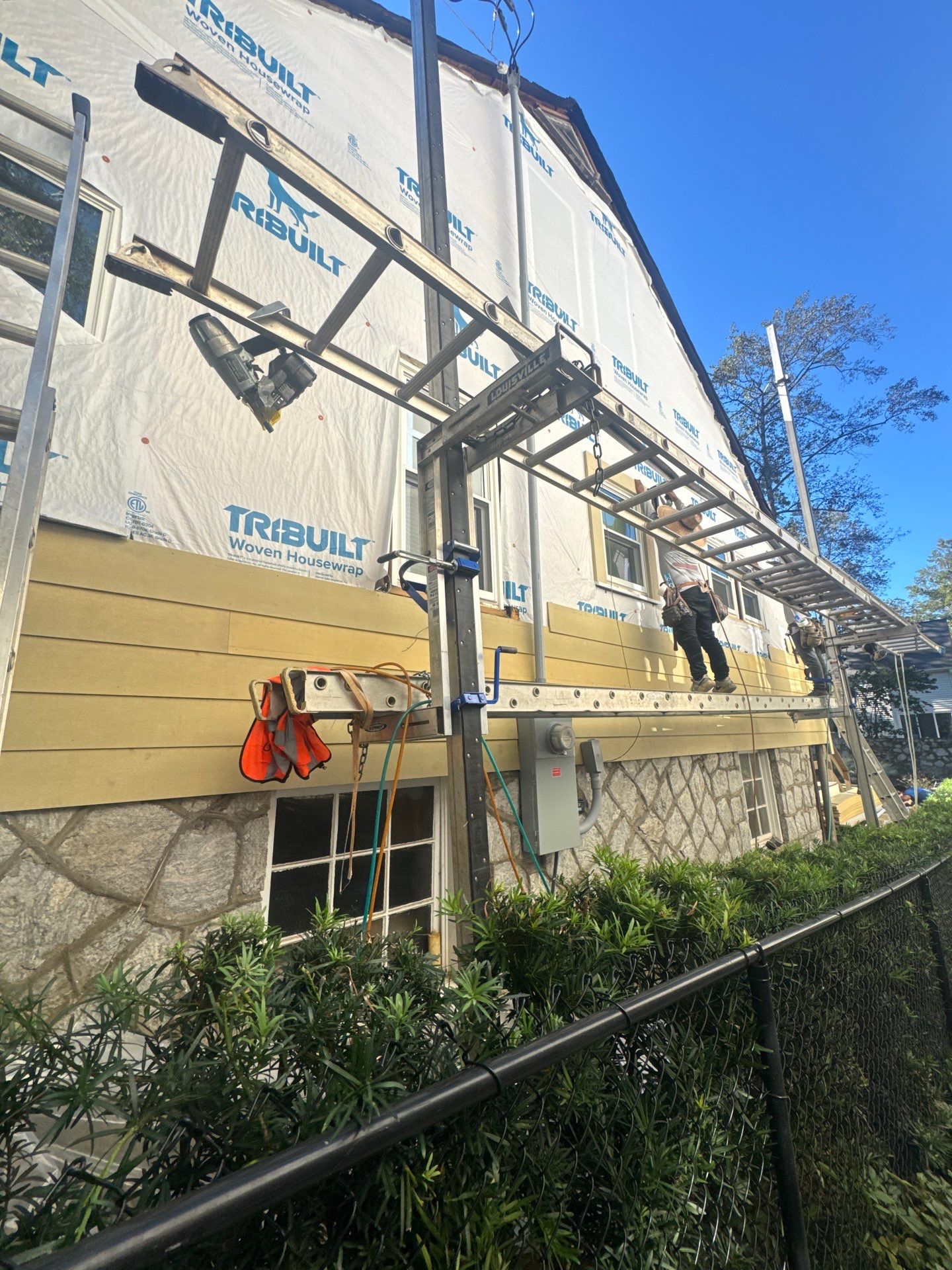 Full Siding Replacement, Deck Build, Exterior Paint, and Gutter Replacement  by Nelson Exteriors 