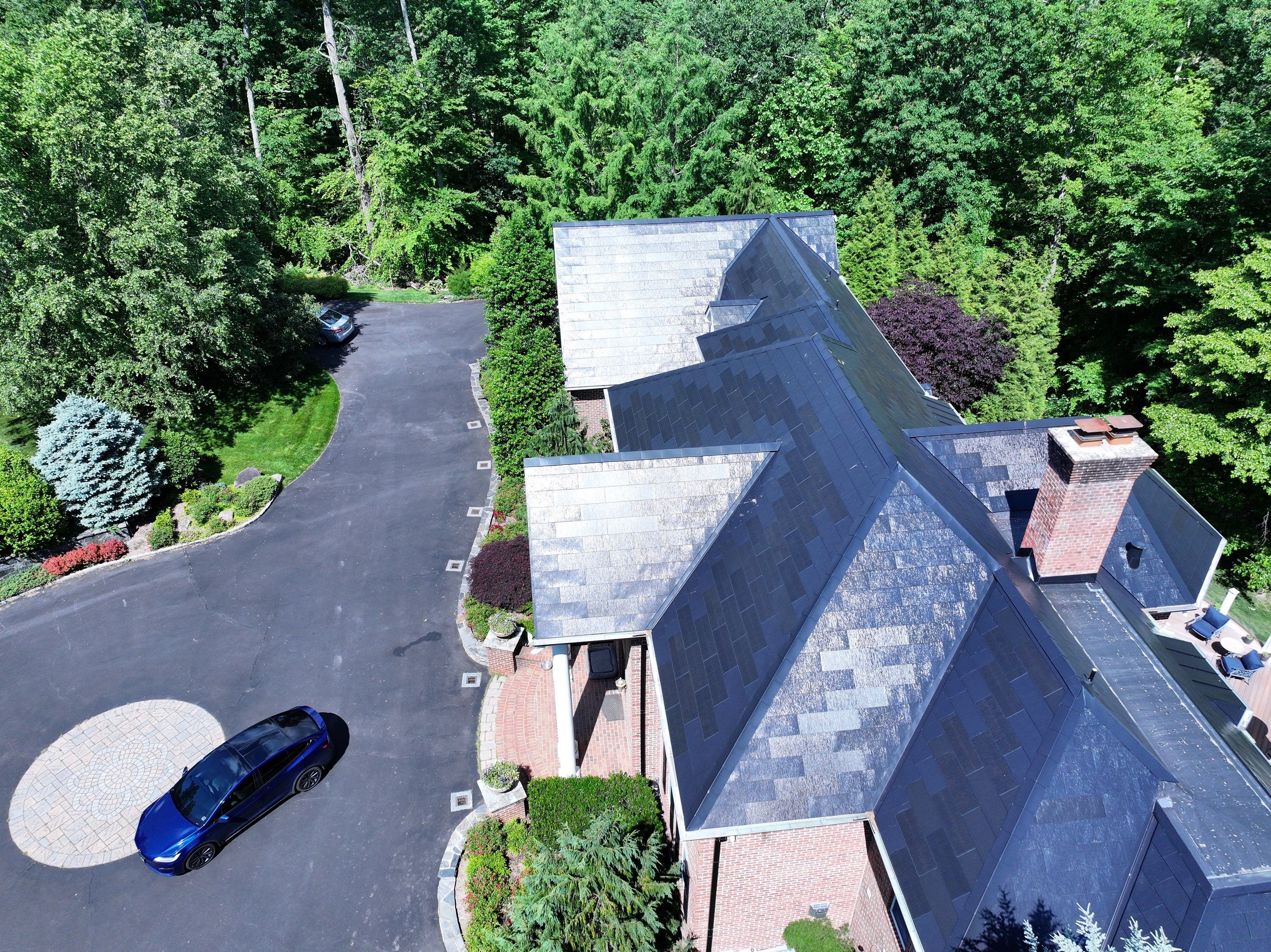 Tesla Solar Roof Replacement by American Home Contractors