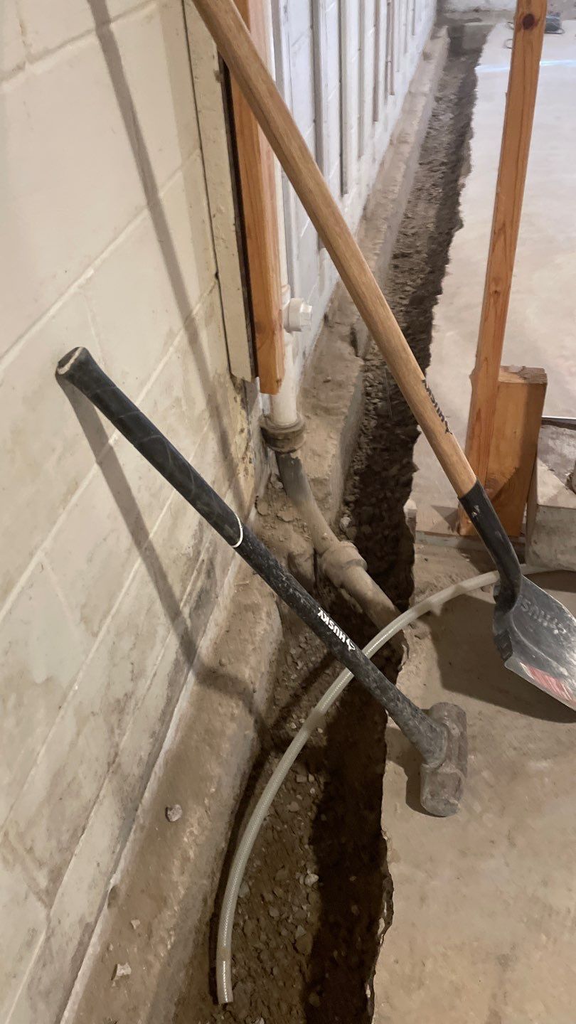 Interior Drain Tile & Buried Discharge in St. Anthony, MN by Waterproofing Northeast