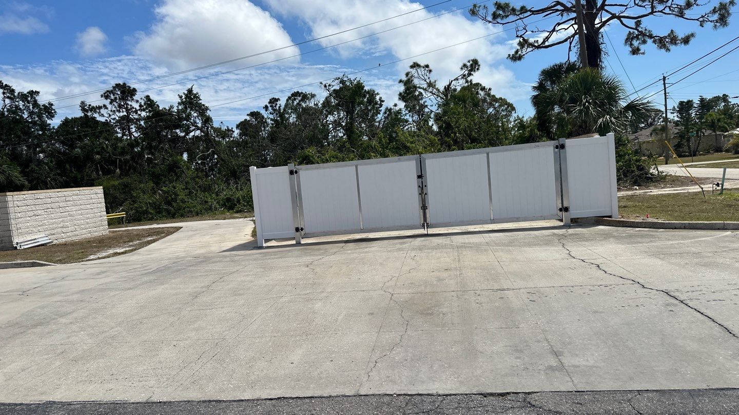 Commercial Chainlink and Vinyl Fence With Aluminum Framed Gates On Dumpster Enclosure by Asap fence and gates, LLC
