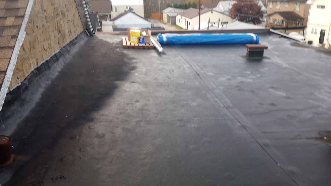 Commercial Roofing Installation using Performance Shingles by Mr. Roofer