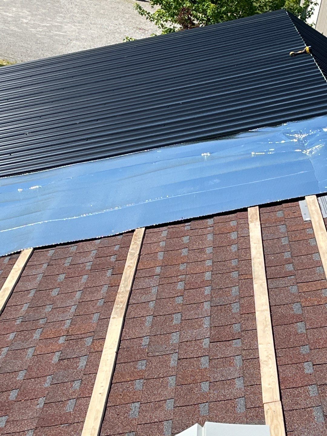 Residential Roofing Installation using Perfromance Panel Metal - Black by RoofX 