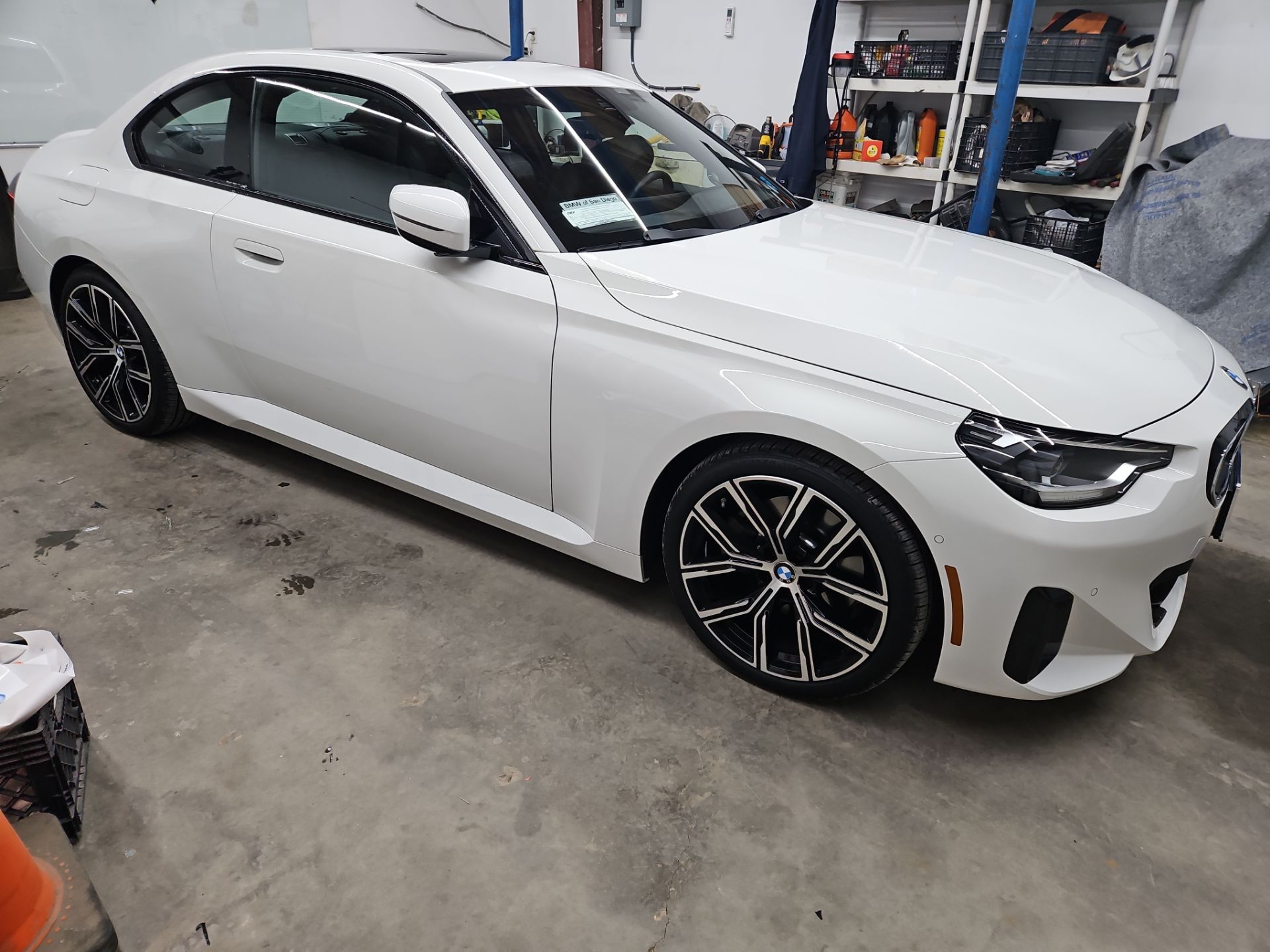 the image shows a white bmw sedan that is likely being prepared for window tinting services the car is clean and well maintained indicating that t's window tinting is focusing on applying professional window film to enhance privacy reduce glare and block uv rays the service aims to improve the overall appearance of the vehicle while providing practical benefits such as temperature control and interior protection the attention to detail suggests a high standard of quality in the tinting process