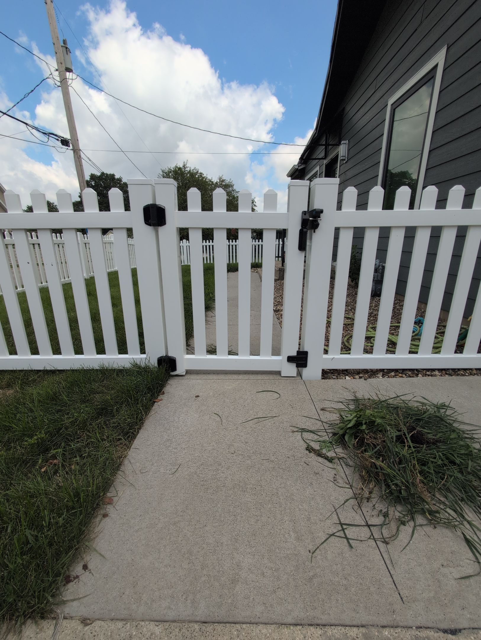 White Vinyl Spaced Picket Fence Installation in Cedar Falls by Perfect Picket Fence and Stain