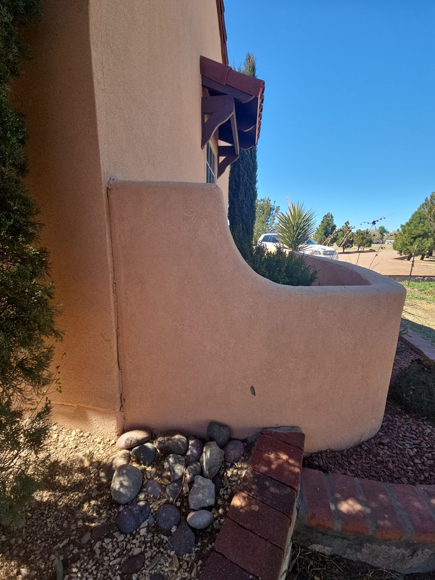 Exterior Painting with Stucco Damage by Regal Renovate