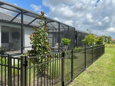Aluminum Fence Installation using Bronze 3 Rail Aluminum Fence