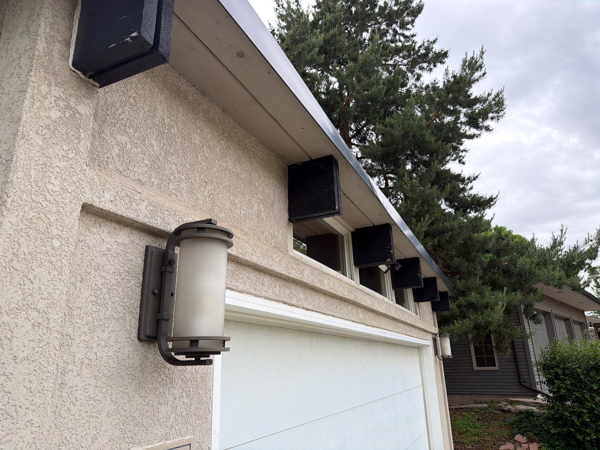Exterior Trim Painting and Rafter Staining in Sioux Falls by Select Painting, Coatings & Garage Cabinets
