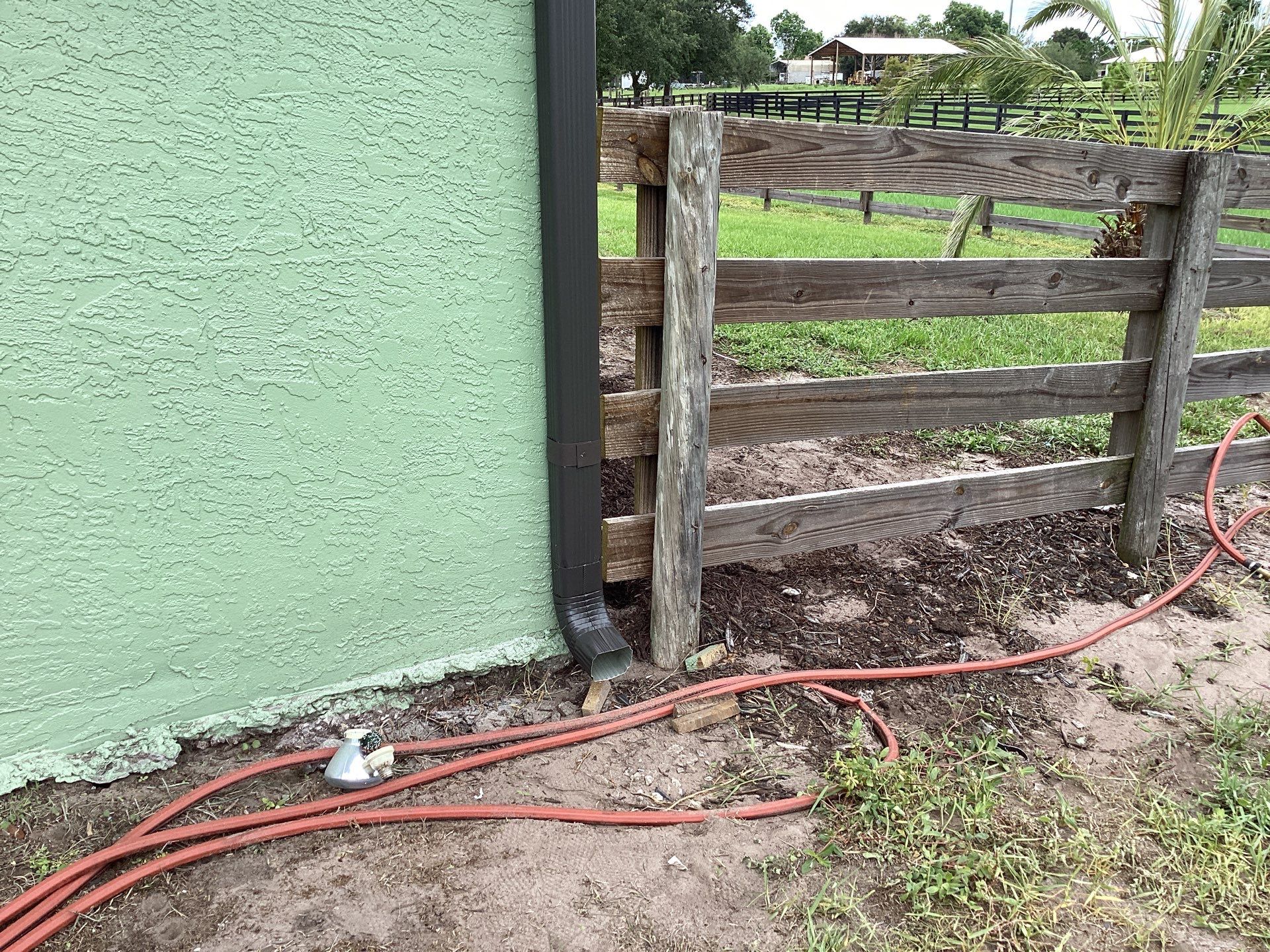 Musket brown downspouts with 6-inch K-Style gutter installation in Myakka City, FL by Gutter Professors