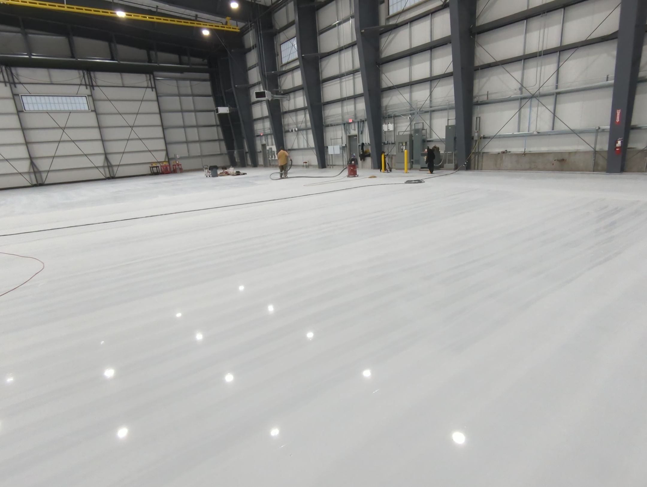 Airplane Hanger using Light Grey Commercial Penntek Epoxy by Croc Coatings, LLC