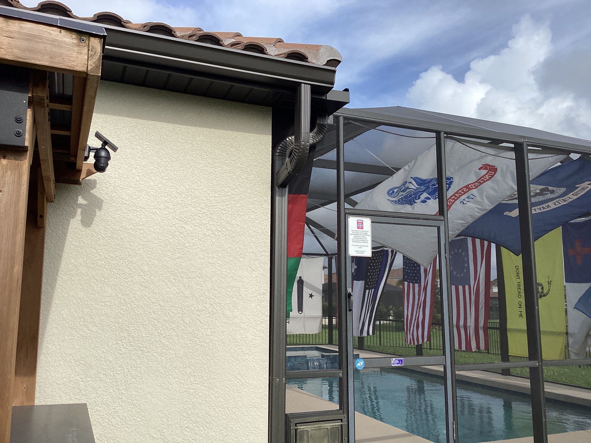 Musket brown seamless gutters with splash guards, new downspouts, and extensions in Bradenton, FL by Gutter Professors