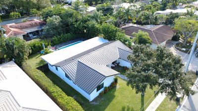 Residential Roofing Installation using 1" Nail strip metal roof