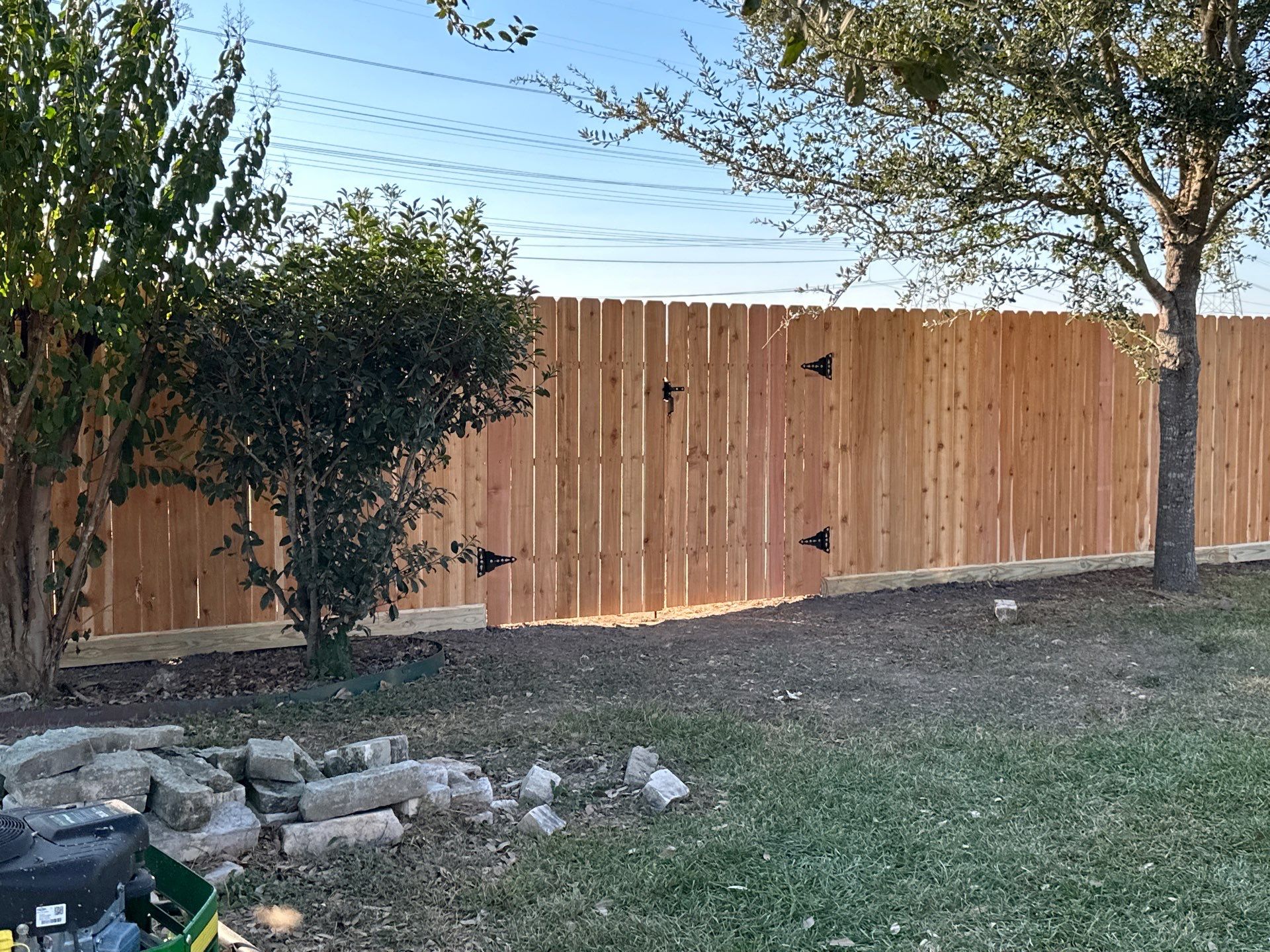 Beautiful Wood fence with metal posts by Tim's Fences