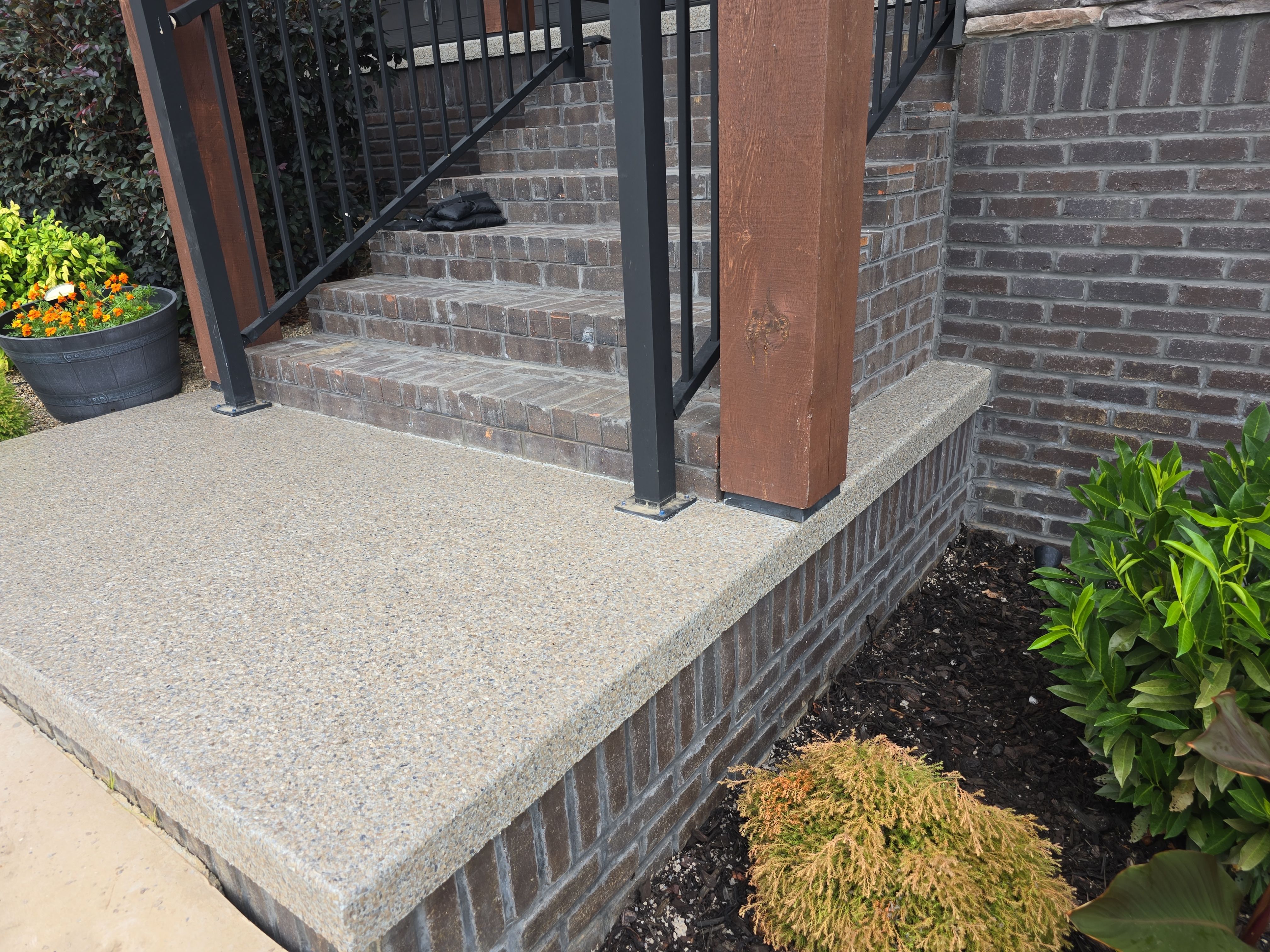 Front Porch and Garage using Obsidian by Elite Floor Solutions