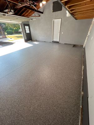 Concrete garage floor replacement and epoxy coating installed 