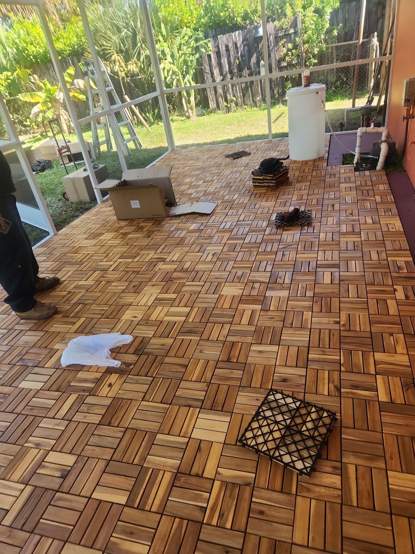 Insulated Screen Enclosure and Wood Tile Deck Installation in Plantation by Aastro Roofing