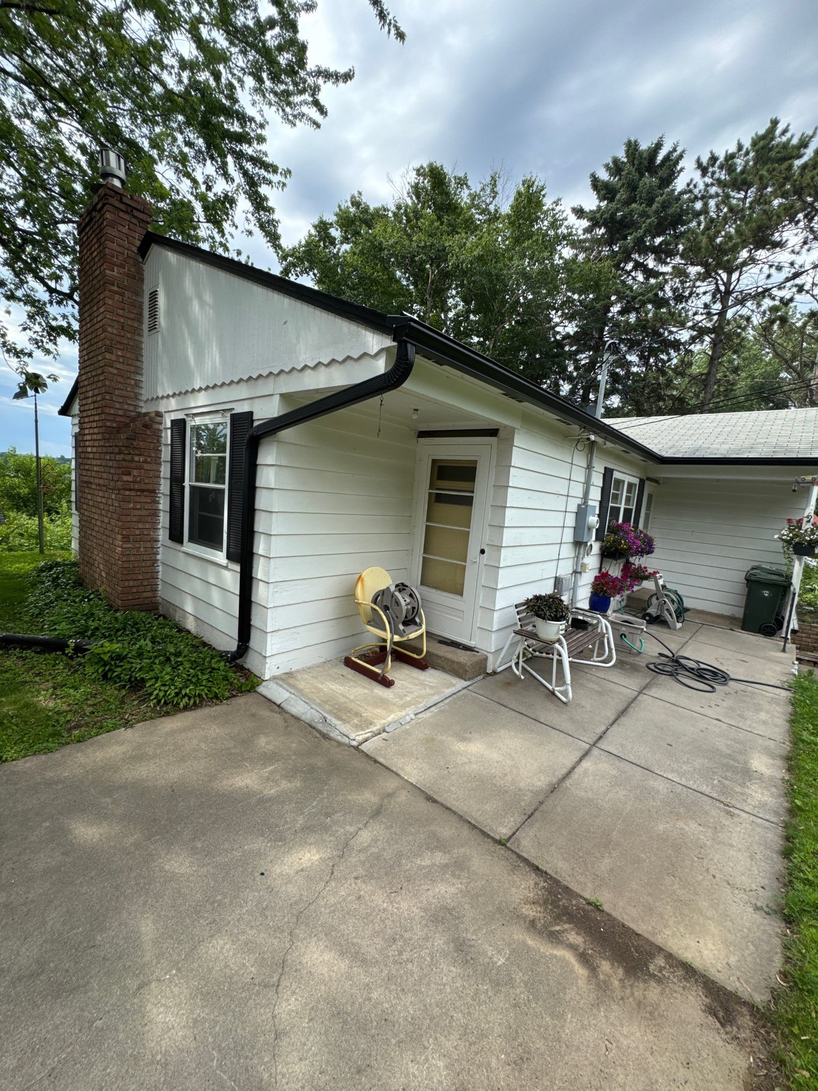 Eagan - Black Seamless Gutters with Helmet Style Guards by Forever Fortified