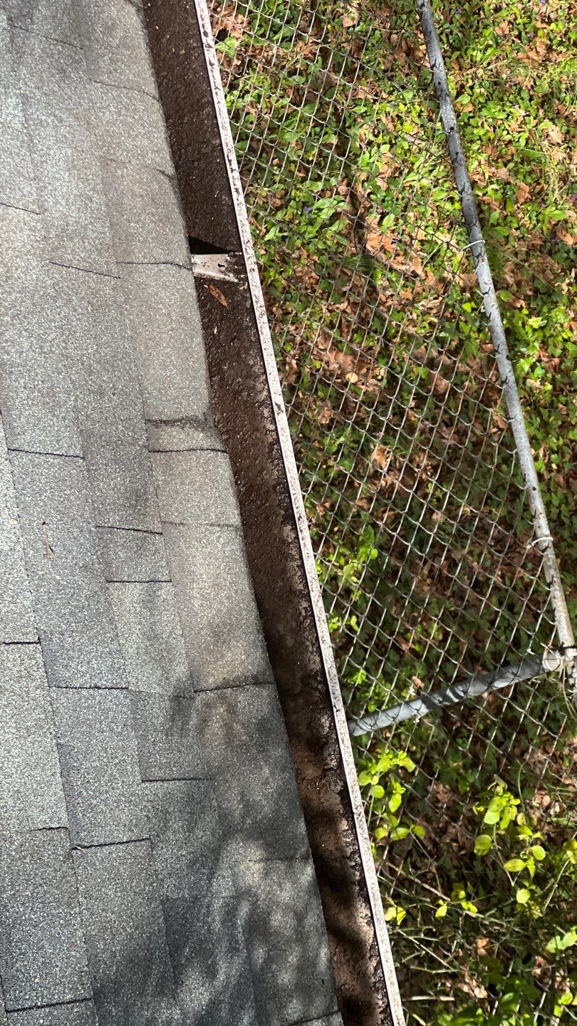 Gutter Cleaning using brown bags by Roof Bullies