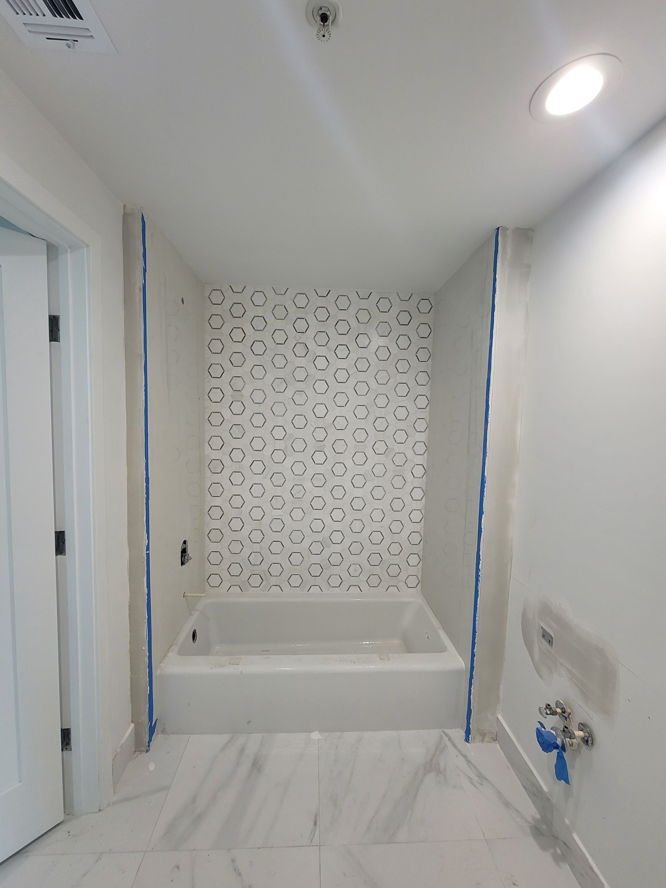 Modern High-Rise Interior Renovation and Custom Tile Installation in Miami by Picos Construction Engineering