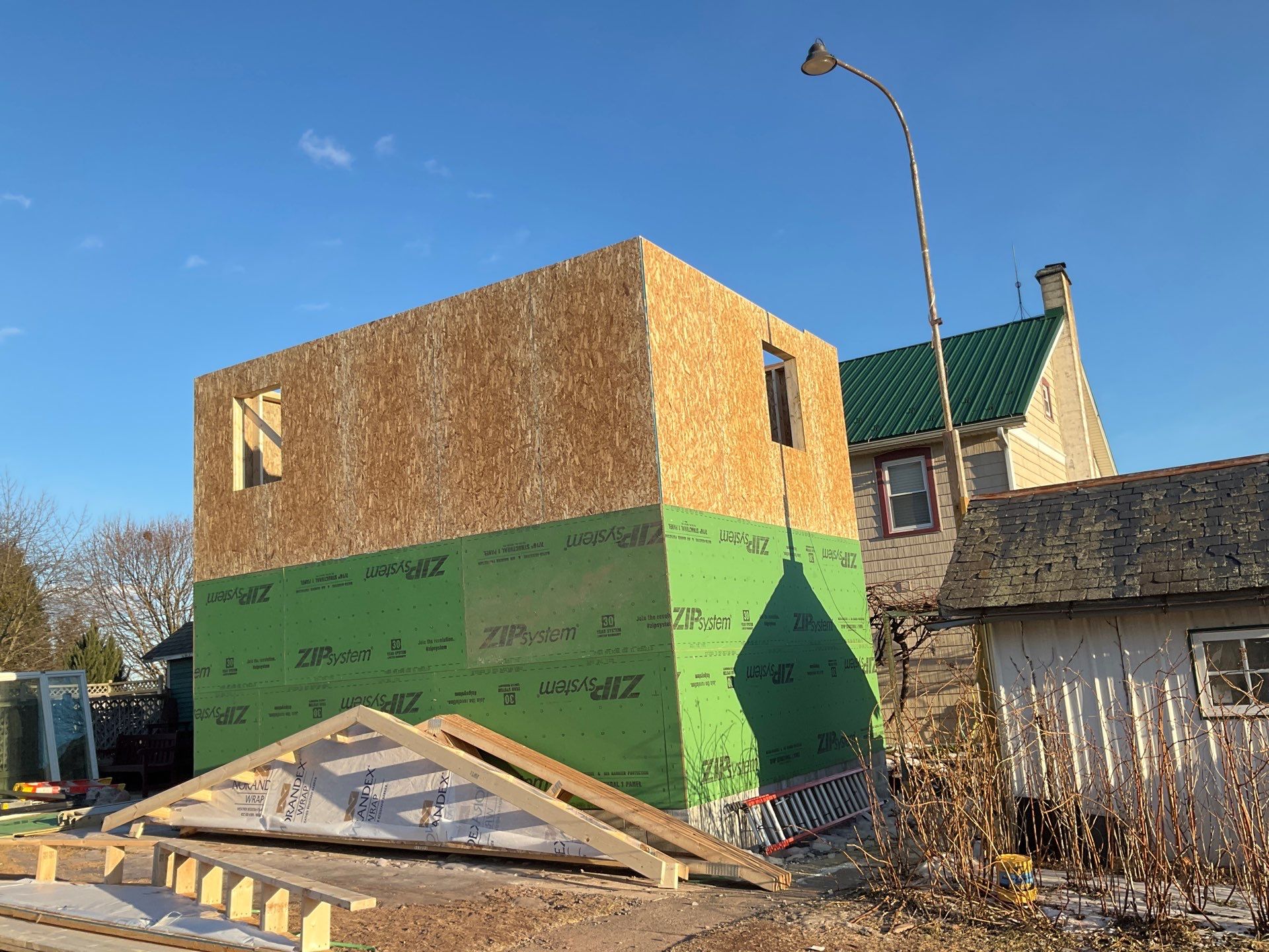 Multi-Story Residential Addition Featuring Textured Metal Siding in Millersburg by Esh Builders