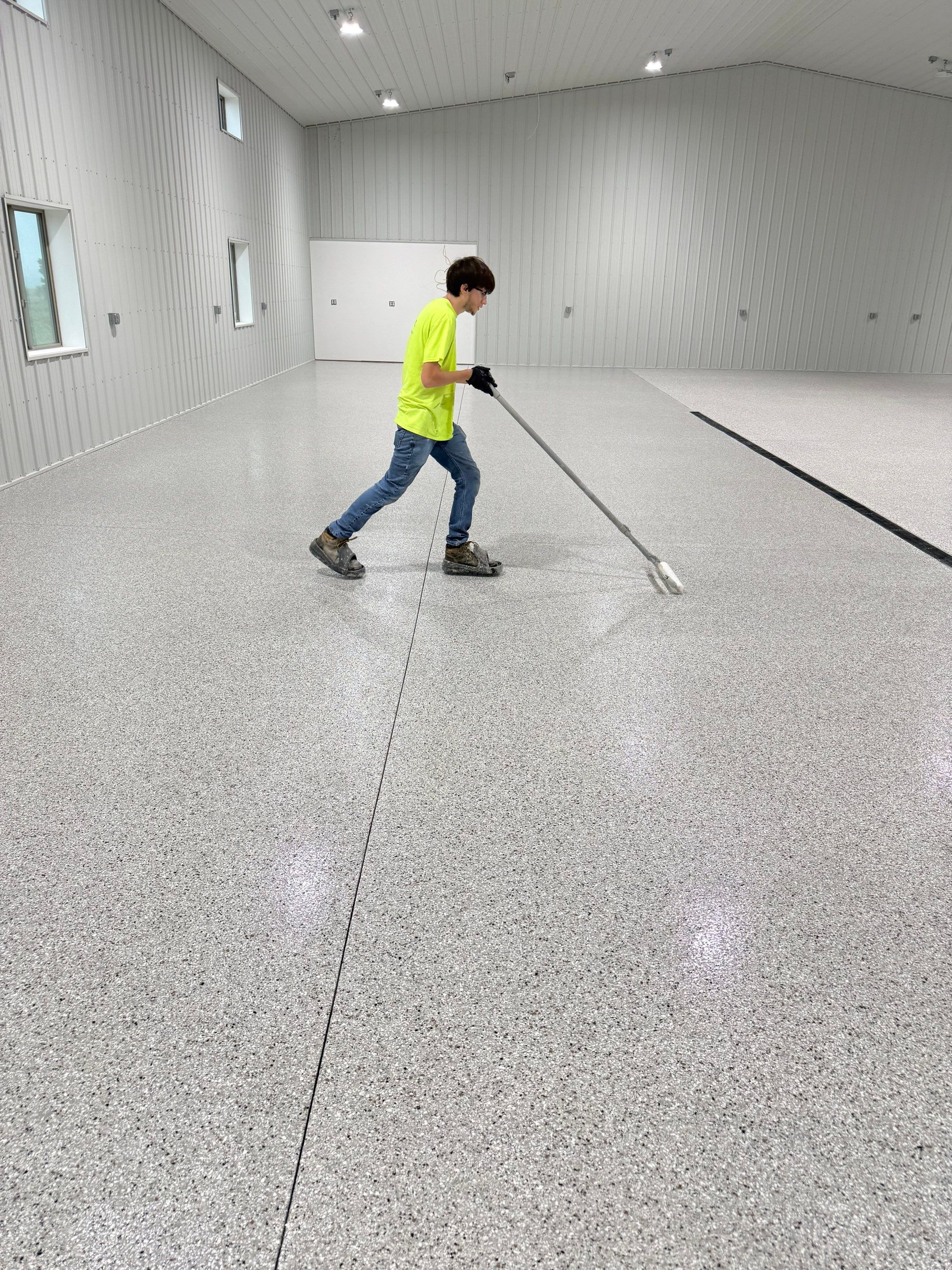 Custom Speckled Floor Coating for Large Montrose Shop by Select Painting, Coatings & Garage Cabinets