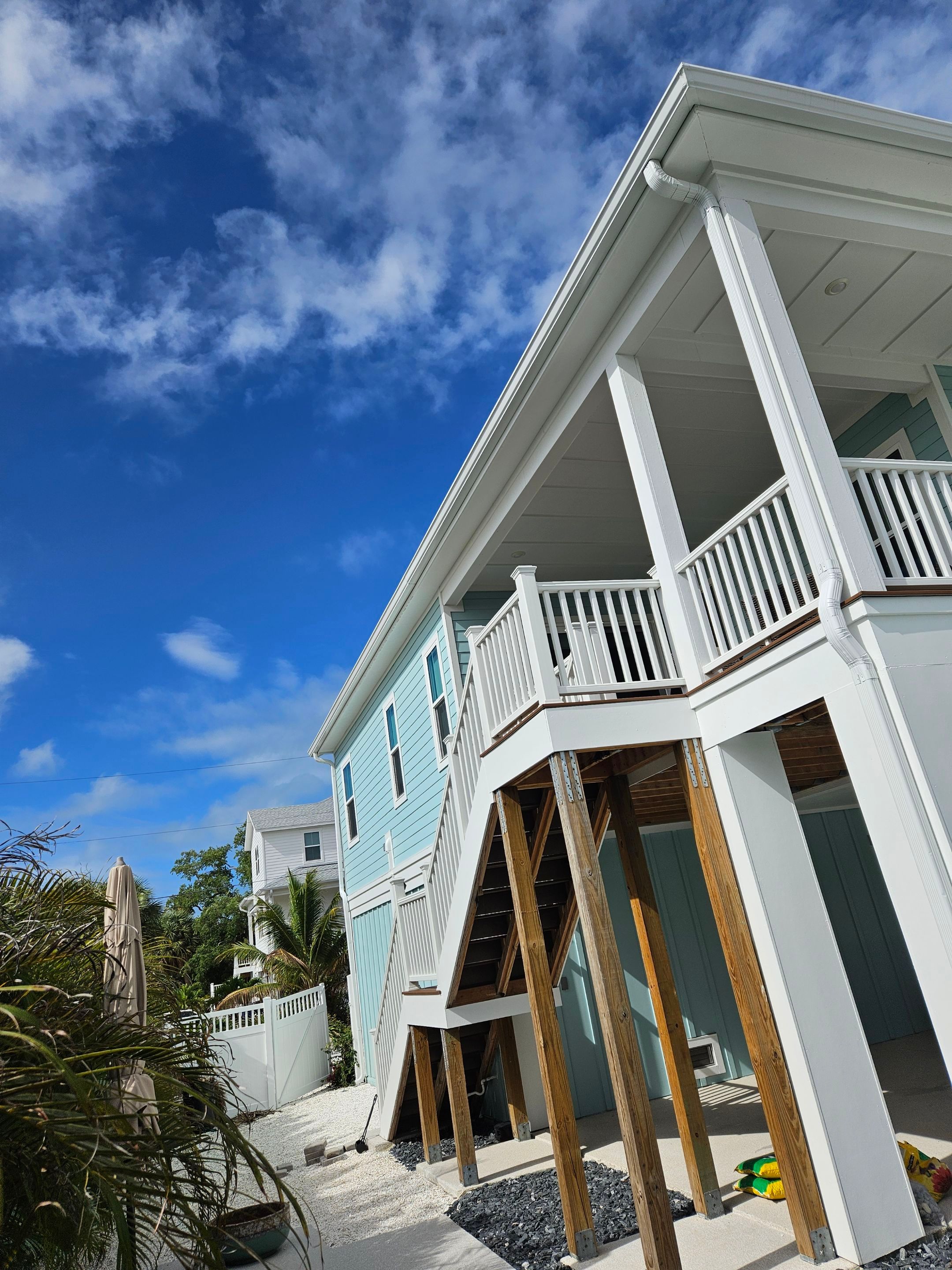 New White Seamless Gutters Installation and Downspouts, Reseal Gutters in Fort Myers Beach, FL  by Gutter Professors
