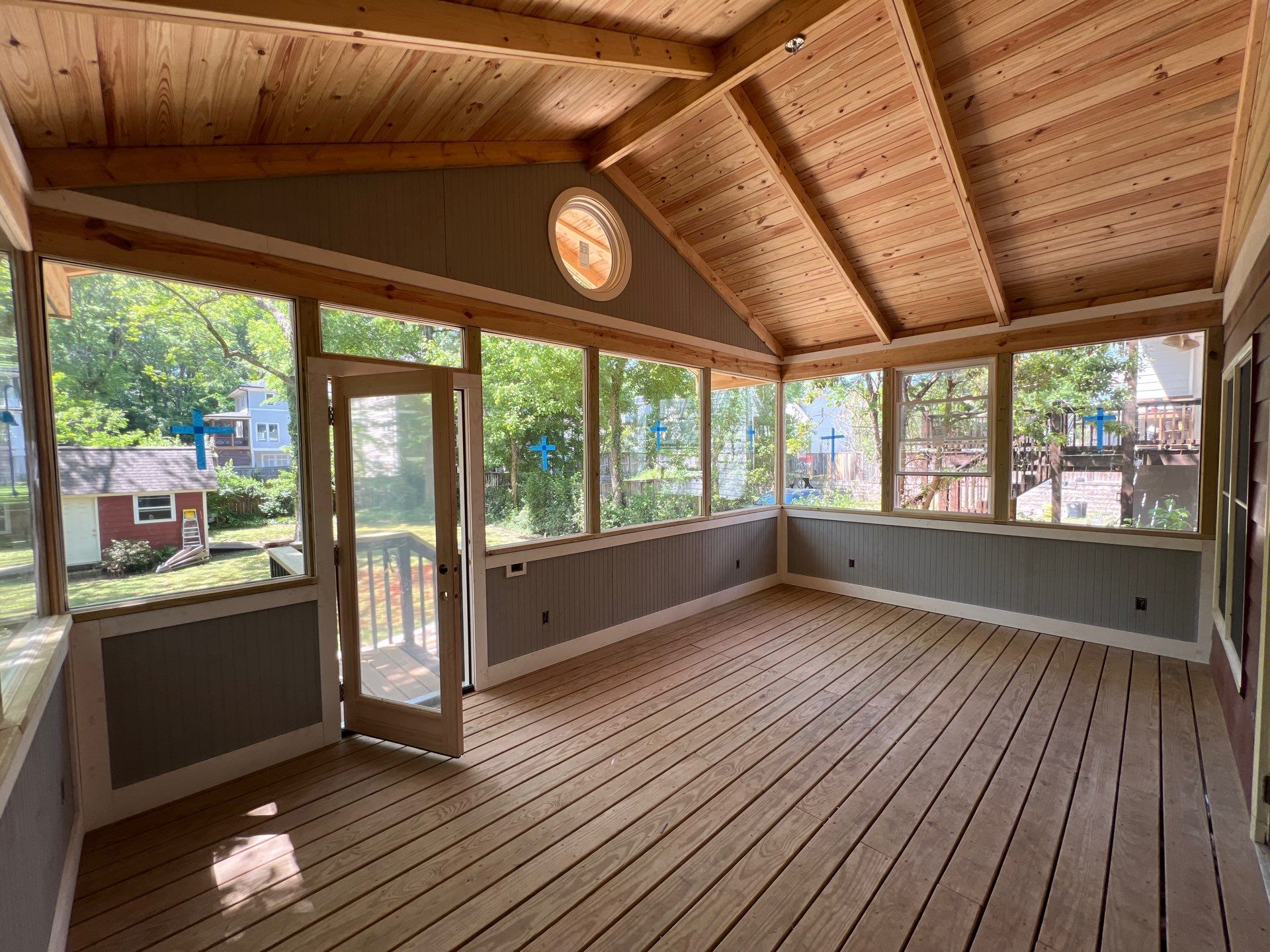 Elevated Screened-In Porch Addition with Vaulted Tongue-and-Groove Ceiling by Swift Home Renovations