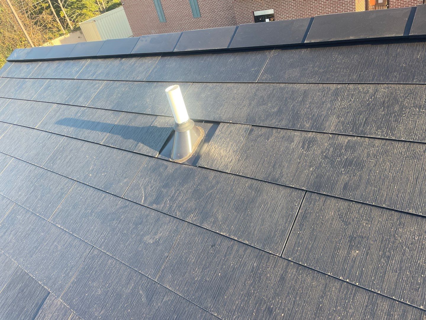 Tesla Solar Roof on a Commercial Building by American Home Contractors