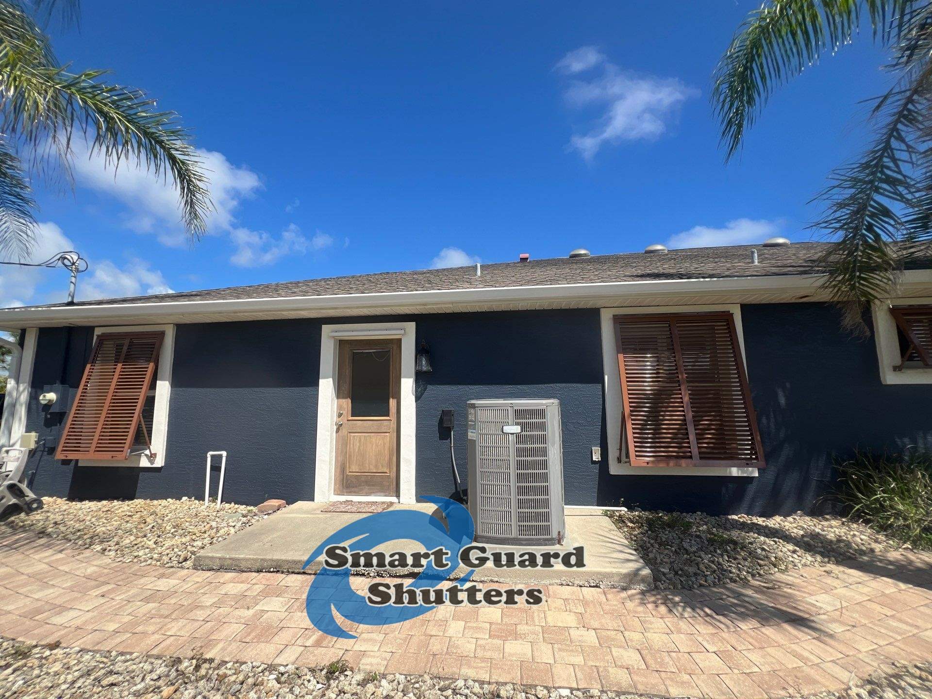 Impact Rated Bahama Shutters in Beige Brown by Smart Guard Shutters