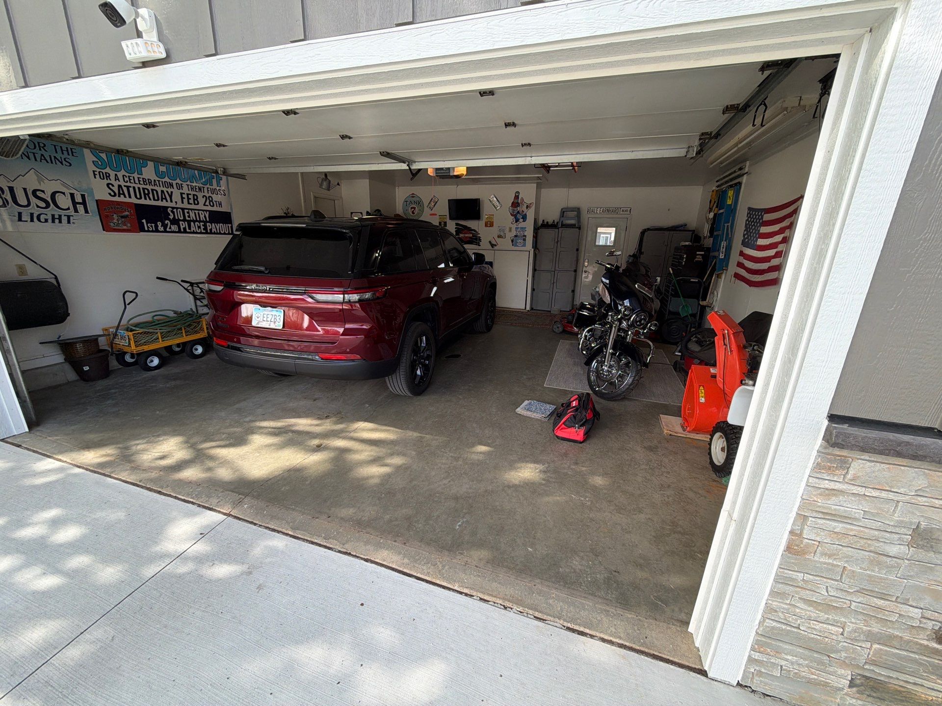 Residential Garage Floor Coating with Feather Grey Finish in Sioux Falls by Select Painting, Coatings & Garage Cabinets