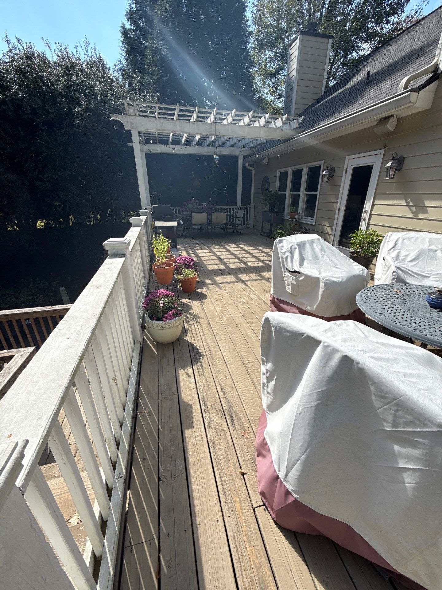 Deck Resurface and Screened-In Porch Build with Timbertech LED Lantern Post Cap Lights by Nelson Exteriors