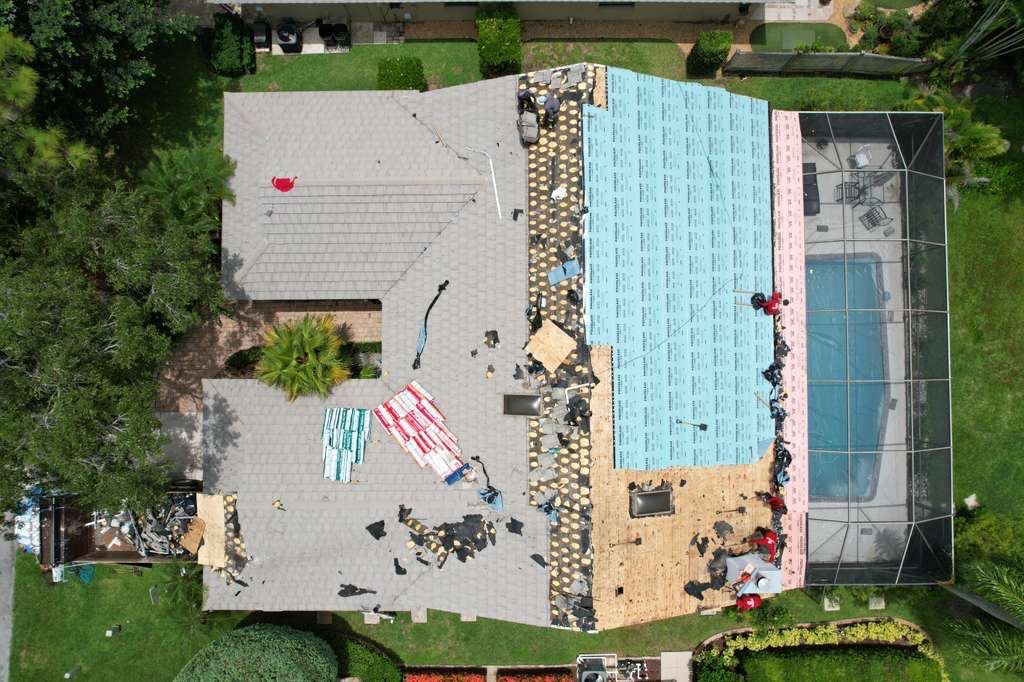 Standing Seam Metal Charcoal Grey Roof Replacement and Skylight Installation in Jupiter by Art's Roofing & Construction