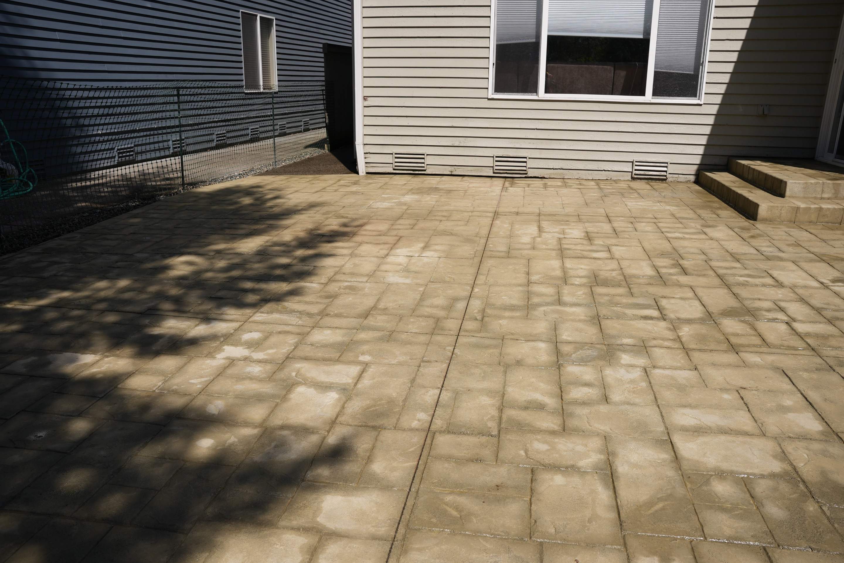 Benedict | Stamped Concrete Back Patio by Jireh Asphalt & Concrete Inc 