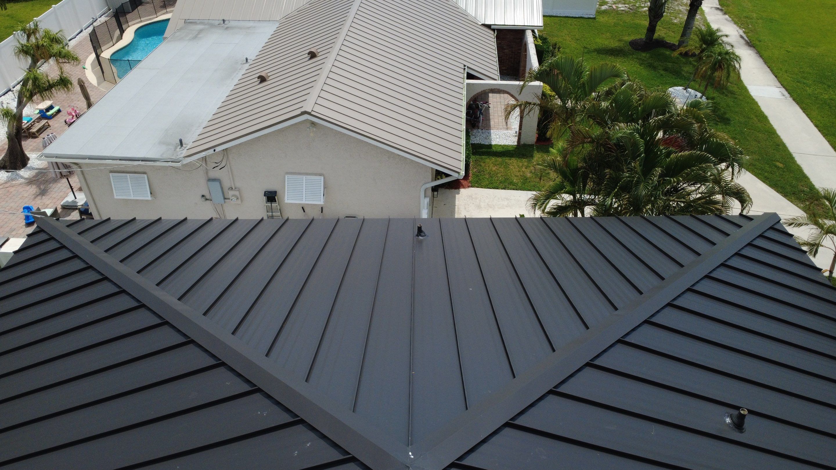 Residential Roofing Installation using 1.5'' Mechanical Seam by BLUES BROTHERS ROOFING