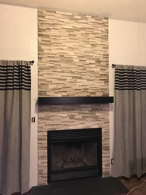 Wood Fireplace + stone + mantel