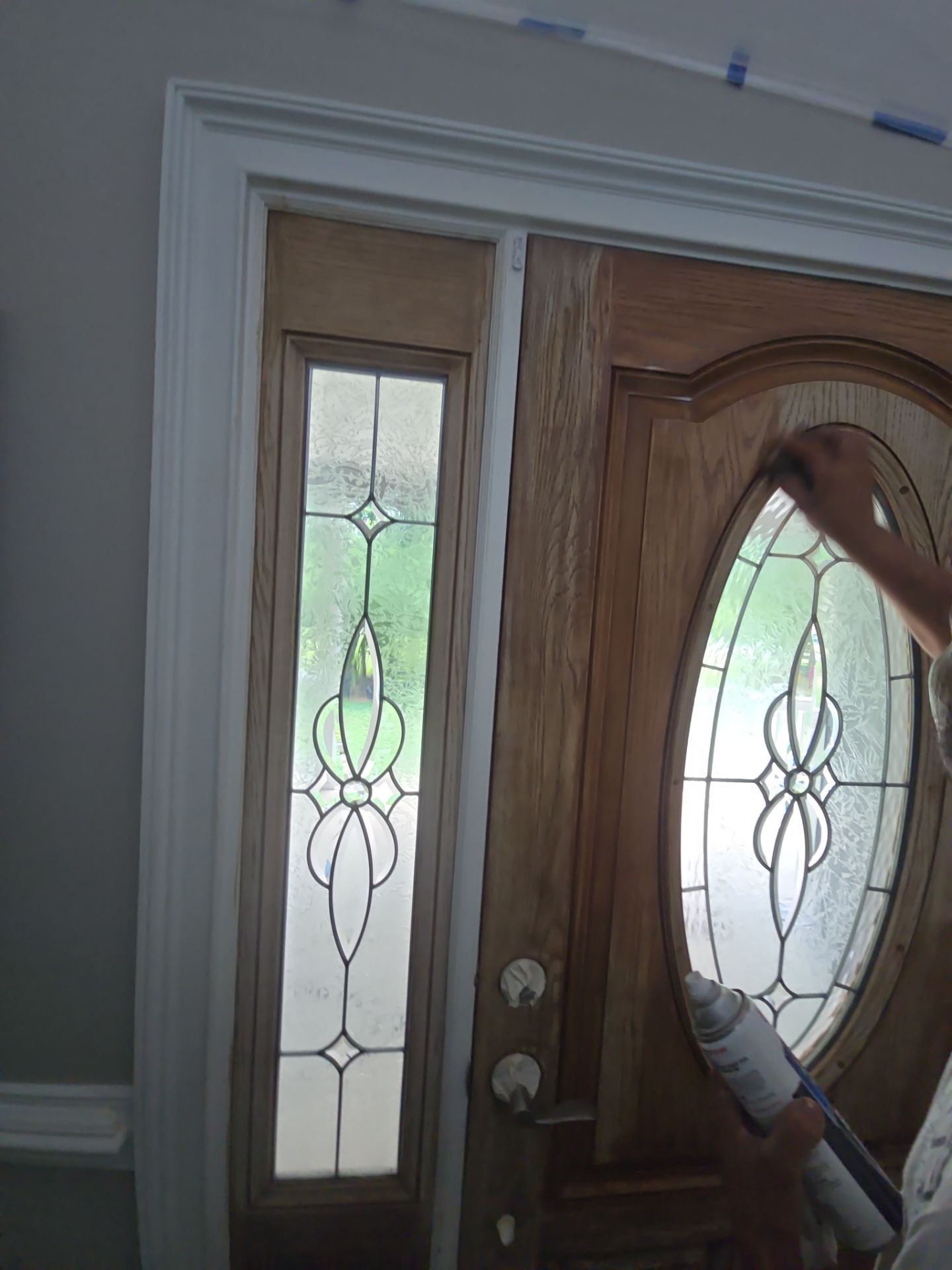 Siding replacement, exterior painting, and front door staining. by GonzalezPainters & Contractors Inc