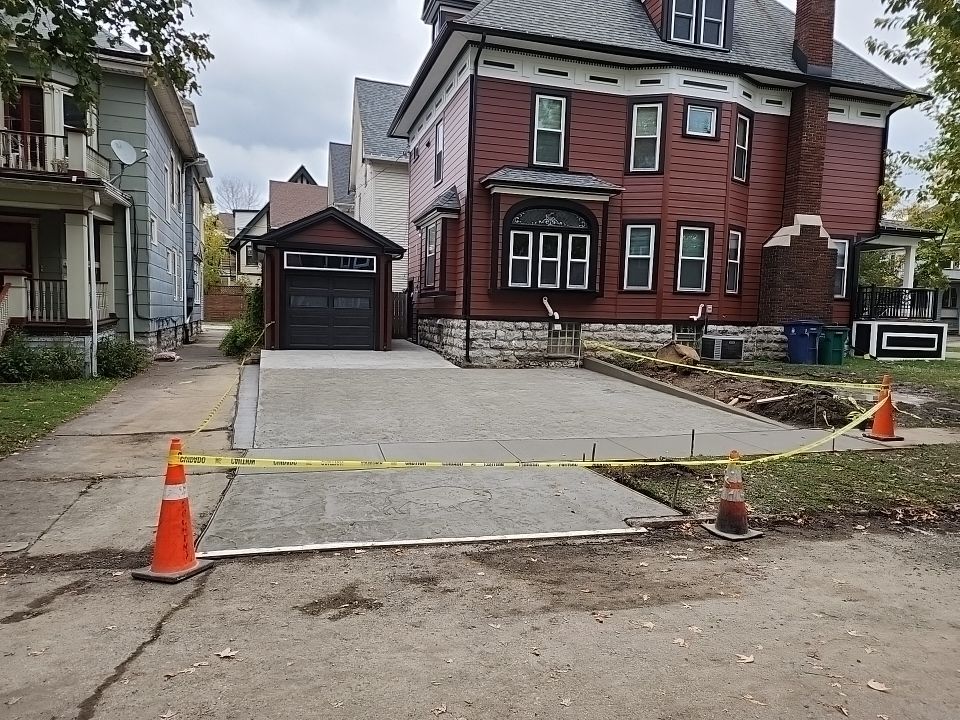 Exterior Renovations- Siding, Stamped Concrete, Porch, and Railings by Ivy Lea Construction