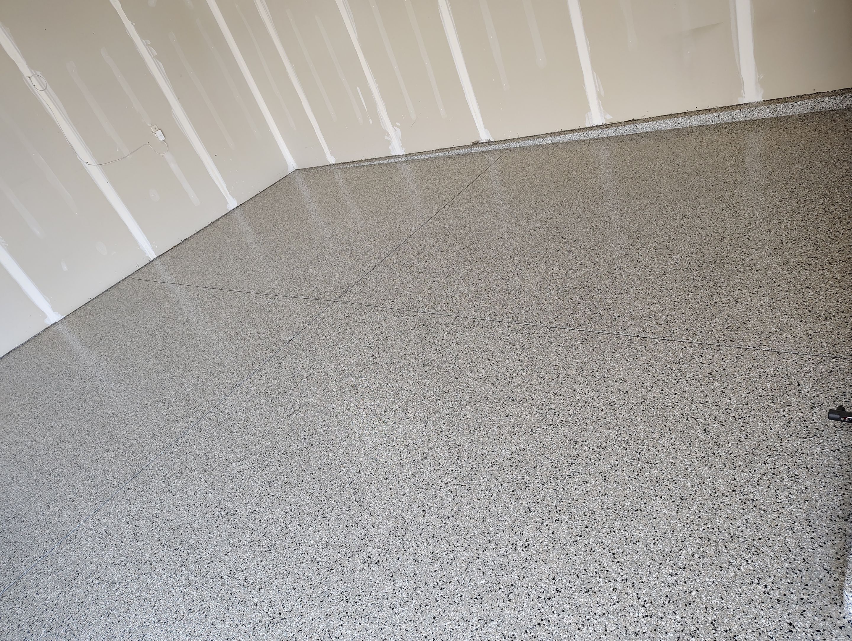 Epoxy Garage Floor Coating with Decorative Flake in Harrisburg by Select Painting, Coatings & Garage Cabinets