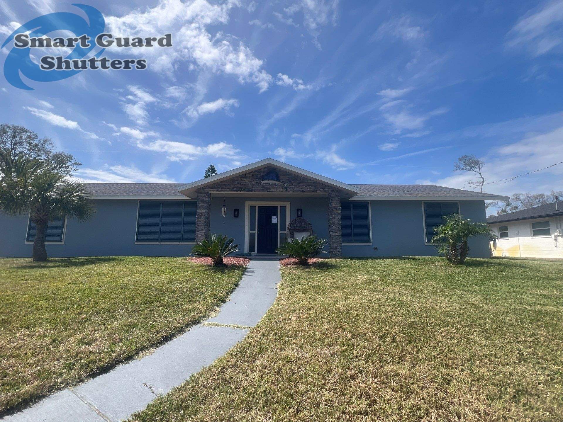 Impact Bahama Shutters in Grey Blue by Smart Guard Shutters