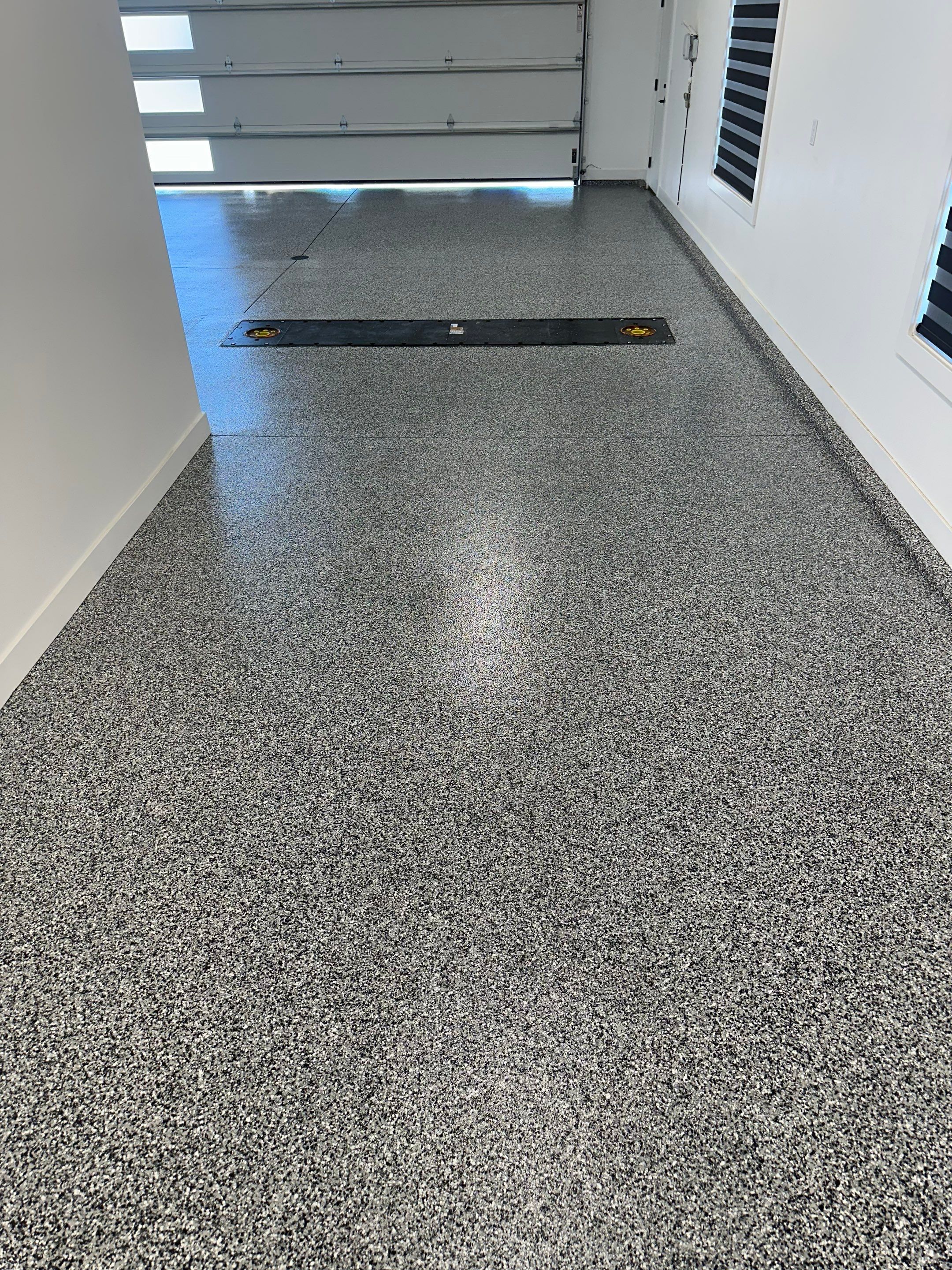 Multi-Color Epoxy Flake Garage Floor Installation in Sioux Falls by Select Painting, Coatings & Garage Cabinets