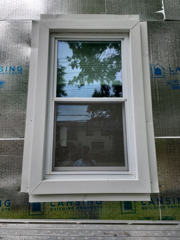 Vinyl siding layover project for 2 family in Wellesley, MA by UBrothers Construction