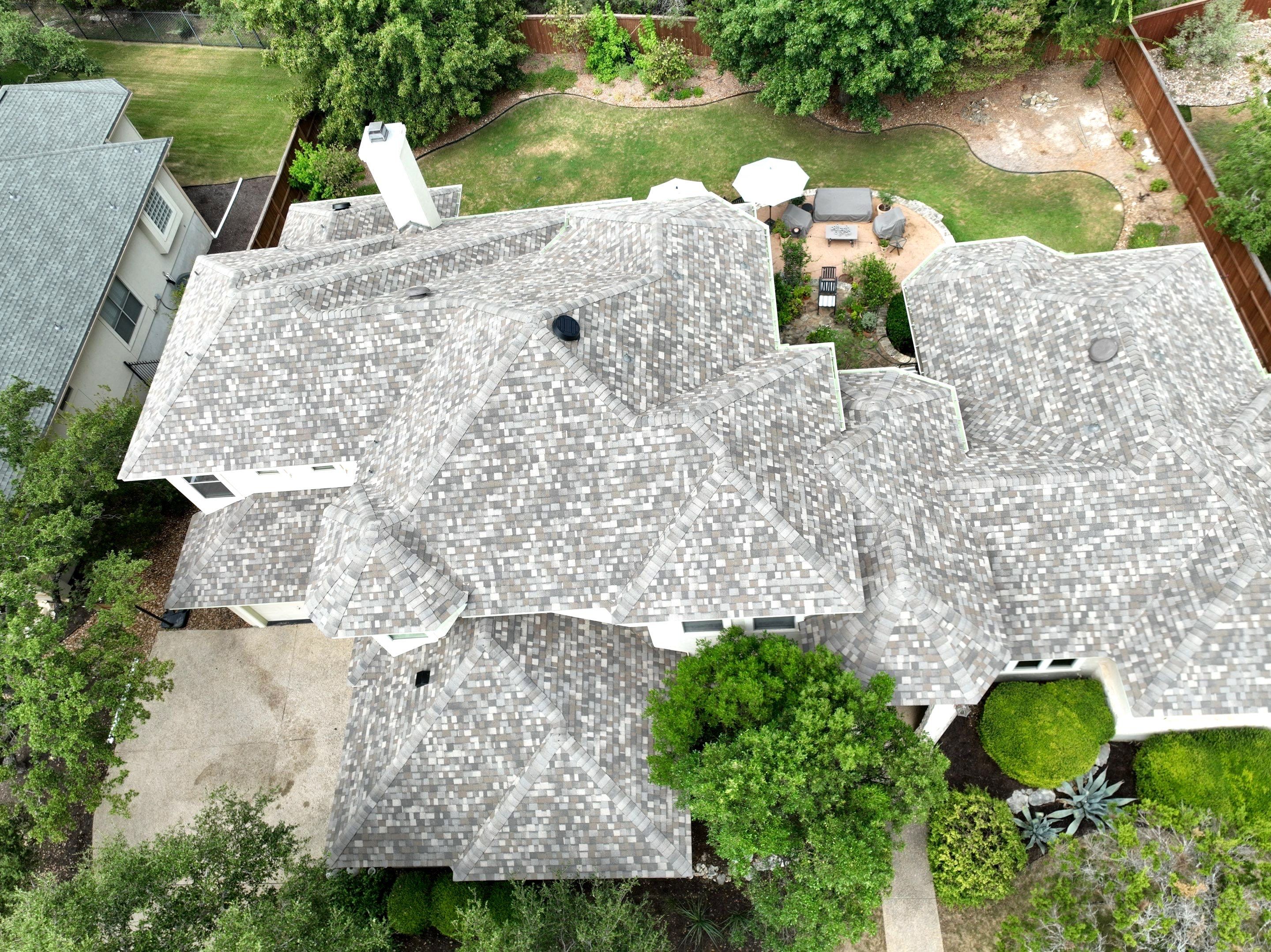 Residential Roof Replacement using 30 Year Laminate Shingles with High Profile Ridge by Premier Roofing and Contracting