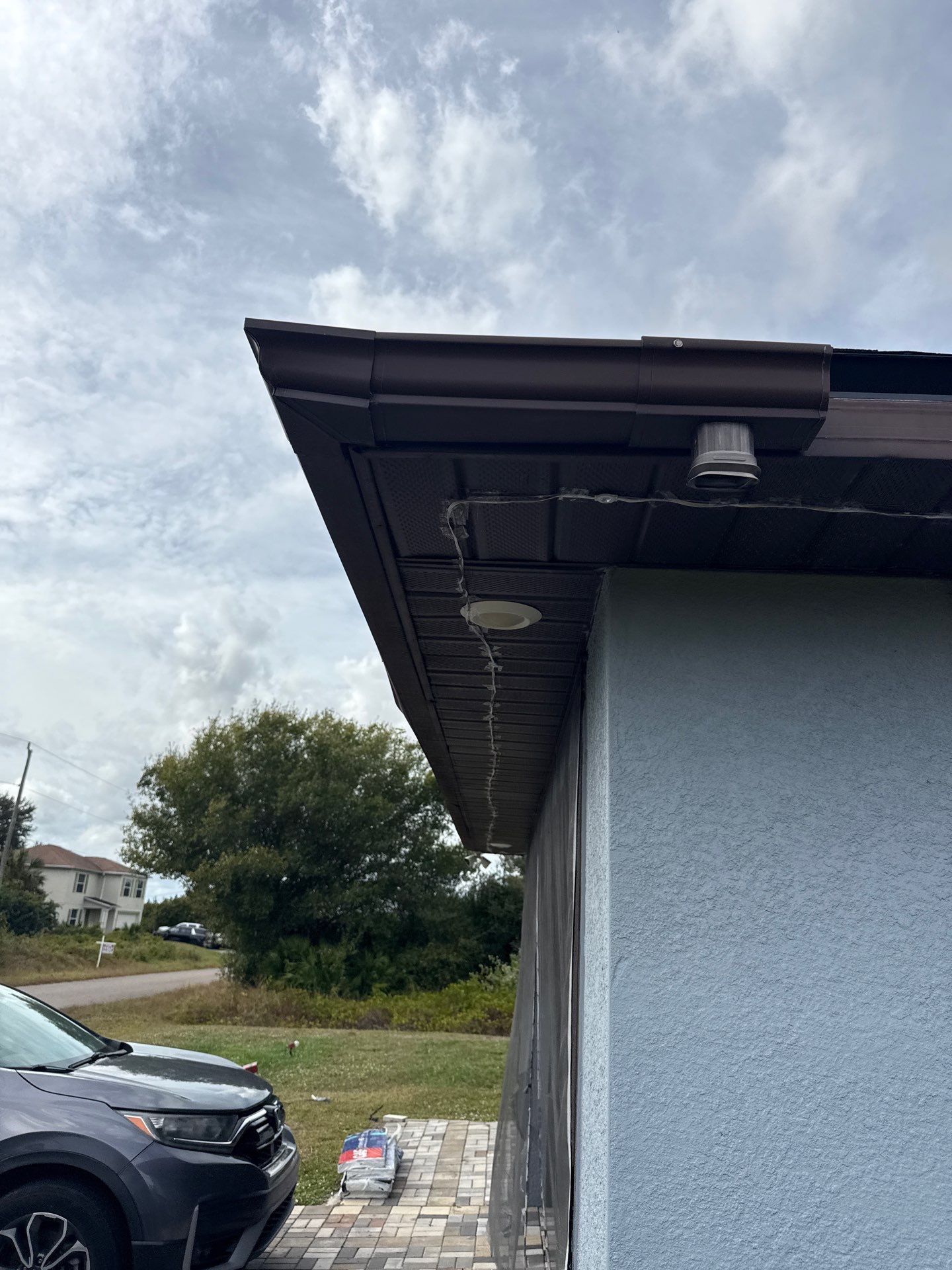 Black Seamless Gutters & Soffit/Fascia in Lehigh Acres FL by Gutter Professors